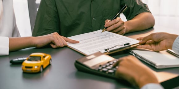 shutterstsock-signing-papers-calculator